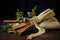 mistletoe tied to decorative cinnamon sticks on burlap cloth