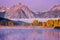 A misty autumn morning at Oxbow Bend in the Snake River, in Grand Teton National Park.