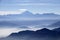 Misty blue Andean mountain landscape background