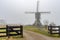 Misty and calm windmill sunrise