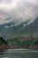 Misty cloudscape above mountain shoreline on Daning River, Wuchan, China