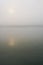 Misty dawn in Chitwan. Morning river. the sun through the fog