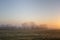 Misty Fields in Farm at Sunrise