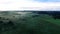 Misty fields in morning birds eye view