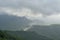 Misty green grass covered mountains of Matheran a hill station nestled in western ghats of India during rainy monsoon season