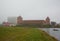 Misty January morning and an old castle