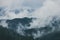 Misty landscape of mountain and forest. Summer foggy and cloudy morning