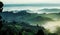 Misty morning landscape, sunrise over hills in Tuscany with garden trees, green hills. Fog in Italian countryside