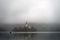 Misty Morning view of famous lake Bled and small island with a church