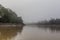 Misty morning view of Kinabatangan river, Sabah, Malays
