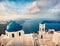 Misty morning view of Santorini island. Picturesque spring scene of the  famous Greek resort Fira, Greece, Europe.