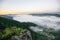 Misty mountain forest landscape in the morning sunrises fog and forest tree view on top Foggy morning mist in valley beautiful sky