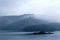 Misty mountains by Sun Moon Lake on a foggy morning, with a pagoda on the distant mountaintop