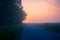 Misty Pathways: Enchanting Gravel Dirt Country Road in a Summer Morning Fog