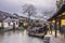 Misty Rain gallery and Boat with black awning at night