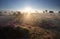 Misty summer sunrise over flowering heather