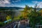 Misty sunrise on the Golden View terrace in the Jizera Mountains with a view of the Karkonosze Mountains. Poland