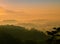 Misty sunrise landscape of mountain and forest at Punthuk Setumbu, Borobudur, Indonesia