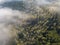 Misty trees from above. Aerial view of Morning fog and sunrise in autumn. Beautiful romantic atmosphere in landscape. Summer time