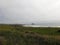 Misty view on pacific ocean with lighthouse