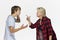 Misunderstandings in family. Angry mother talking to her male teenager against white background