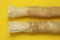 Miswak natural toothbrush on a bright yellow background.Dental hygiene.