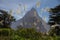 Mitre Peak silhouette with tufted grass foreground, New Zealand