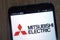 Mitsubishi Electric logo displayed on a modern smartphone