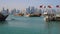 The mix of Ages. View on Doha Modern City Skyline. Day Shot, Qatar, Middle East. Traditional Wooden Qatar Boats with