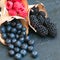 Mix of berries raspberries blueberries and blackberries in a woo