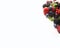 Mix berries on a white background. Ripe blueberries, blackberries, red currants, strawberries, black currant and plums.