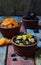 Mix of different varieties of dried fruits on wooden background - dates, apricots, prunes, raisins. Organic healthy food. Excellen