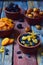 Mix of different varieties of dried fruits on wooden background - dates, apricots, prunes, raisins. Organic healthy food. Excellen