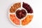 Mix of dried fruits and nuts. Apricot, raisin, cranberry, dates fruit. Isolated on a white background. Space for text or design