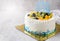 Mix fruits: Kiwi orange and grape on cream cake,
