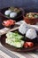 Mix of Japanese food - rice balls onigiri, omelette, ginger, sunomono wakame cucumber salad. Traditional dessert of bean and green