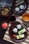 Mix of Japanese food - rice balls onigiri, omelette, ginger, sunomono wakame cucumber salad. Traditional dessert of bean and green