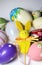 Mix of multicolored vivid Easter eggs and rabbit