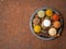 Mix spices on round metal plate - coriander, pepper, salt, rosemary, turmeric, curry. Top view, close up, copy space, metall rust