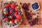 Mix of strawberries in a basket, blueberries and grape