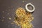 Mix of variety of cereals in glass jar on black stone background