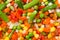 Mix of vegetable containing carrots, peas, corn close up.