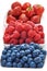 A mixed arrangement. Assorted berries including blueberries, raspberries and strawberry, isolated on white background. Close-up