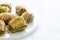 Mixed baklava plate on marble plate.