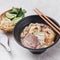 Mixed Beef Pho with noodle and lime served in a dish isolated on grey background side view of vietnam food