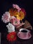 Mixed berbeda flower stilllife with a cup of tea and a book