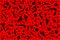 Mixed black shapes and patterns on red background for design material or print