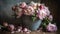 Mixed bunch of open flowering peonies in pastel shades of pink in a vintage zinc bucket, with pink silk ribbons