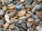 Mixed colour pebbles on a beach