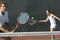 Mixed Doubles Player Hitting Tennis Ball